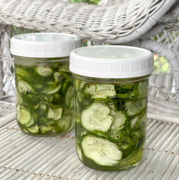 Two jars of freezer cucumber pickles.