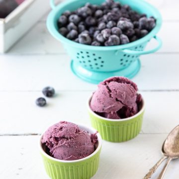 Two bowls of blueberry frozen yogurt