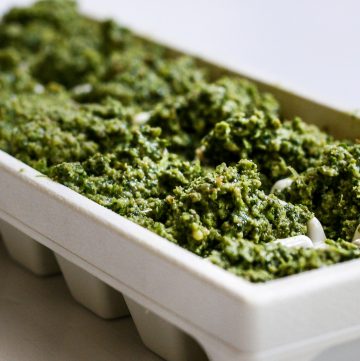 Parsley pesto in an ice cube tray.