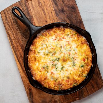 Cheesy frittata in a cast iron skillet.