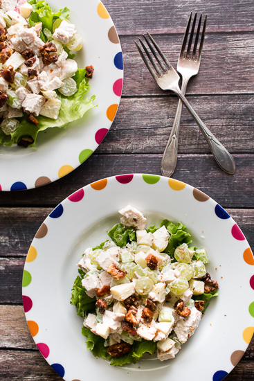 Overhead shot of chicken waldorf salad on a white plate.