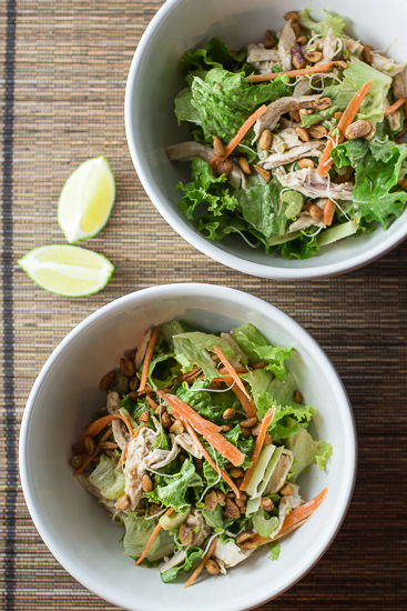 Two white bowls with chicken salad.