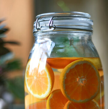 Jar of orange slices in vodka.