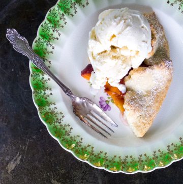 Peach tart with a scoop of ice cream.