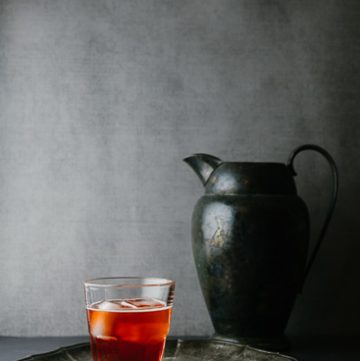 Dark red cocktail on a silver plattter