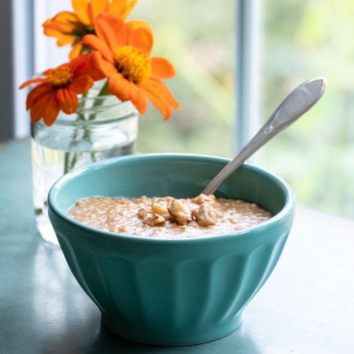 Blue bowl with oatmeal in it.