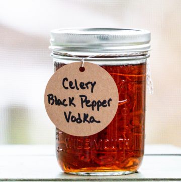 Canning jar filled with vodka and labeled Celery Black Pepper Vodka.