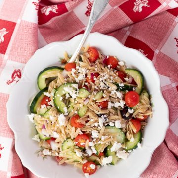 white bowl filled with Greek Orzo Salad