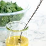 Jar of homemade lemon vinaigrette dressing.
