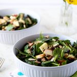 Two bowls of spinach salad with Smoked salmon