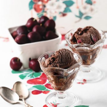 Two sundae glasses with cherry chocolate sorbet.