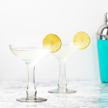 Two cocktails glasses filled with a floridita daiquiri.