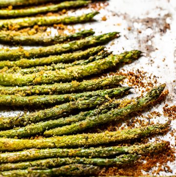 Close up of roasted asparagus with crispy browned bread crumbs.