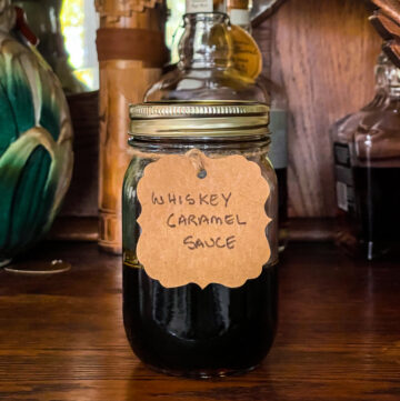 Jar filled with whiskey caramel sauce.