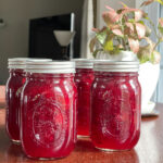 Jars of home canned cranberry sauce.
