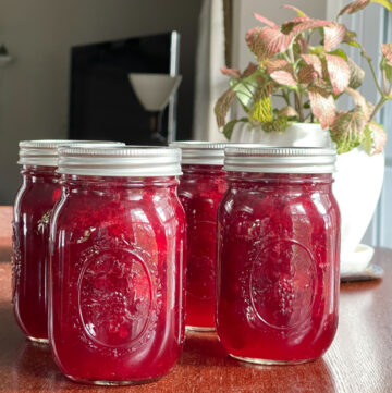 Jars of home canned cranberry sauce.